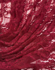 Burgundy Floral Stretch Lace Fabric close up deep red floral pattern draped