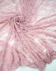 Blush pink floral stretch lace fabric draped and swirled romantic feminine bridal