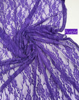 Vibrant purple eggplant floral stretch lace gathered in soft folds with purple label