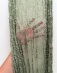Sage Green Floral Stretch Lace Fabric draped showing delicate vintage floral pattern