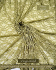Moss green floral stretch lace fabric labeled 4-way stretch, multiple yards in one piece