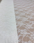 Ivory Floral Stretch Lace Fabric two sections showing dense and open floral pattern