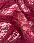 Burgundy Floral Stretch Lace Fabric gathered folds showing sheer texture and depth