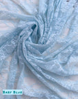 Close up Baby Blue Floral Stretch Lace Fabric with Baby Blue label