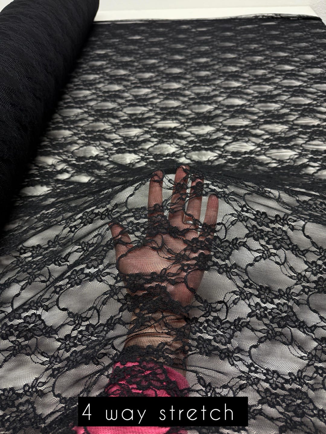 Black floral stretch lace fabric 4-way stretch label, 90% nylon 10% spandex