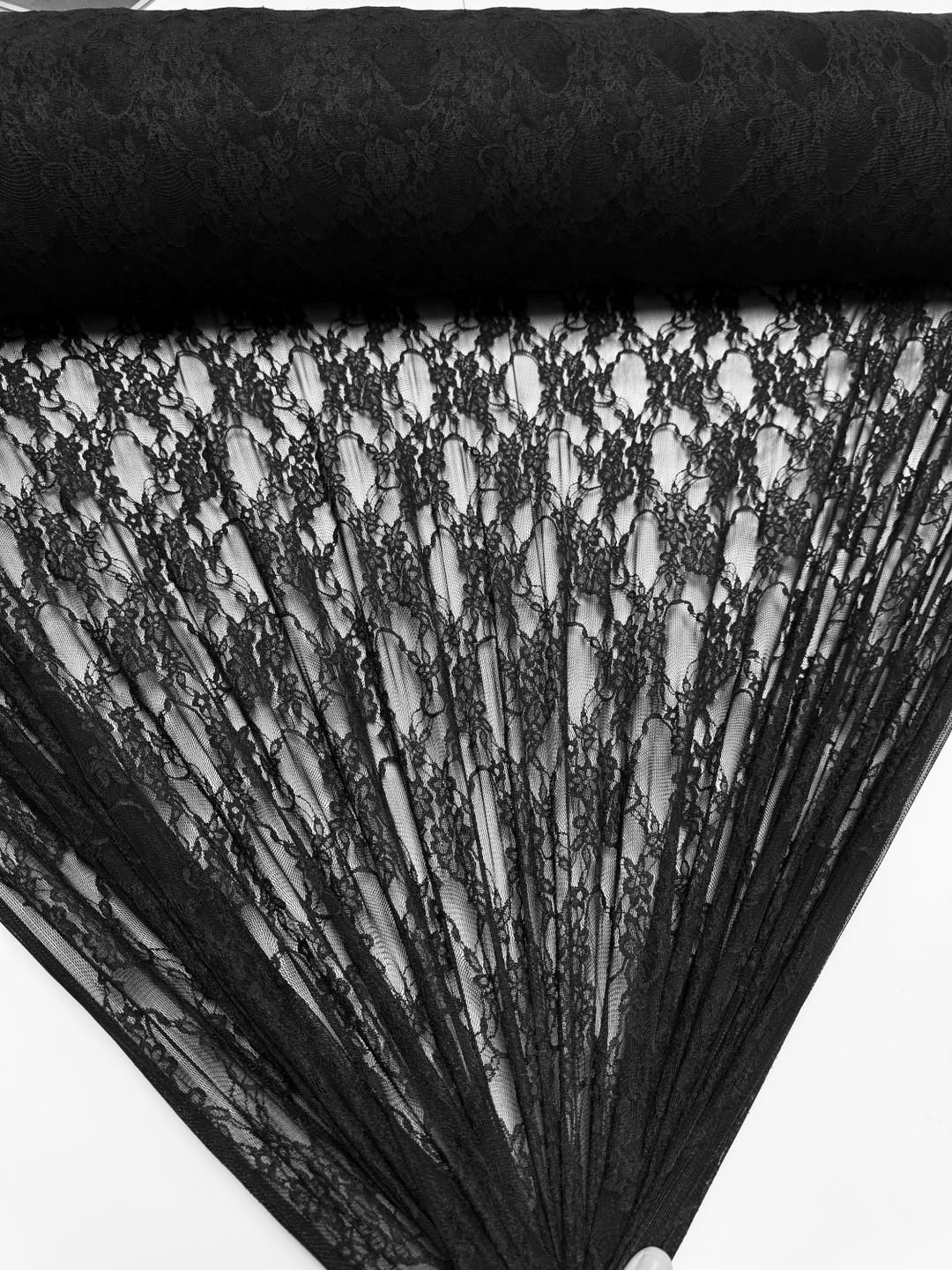 Black floral stretch lace fabric rolled, vintage style semi-sheer lace