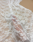 Ivory Floral Stretch Lace Fabric close up semi-transparent floral pattern