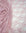 Blush pink floral stretch lace fabric draped and folded showing intricate pattern