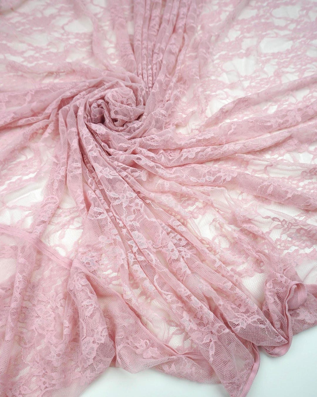 Blush pink floral stretch lace fabric draped and swirled romantic feminine bridal