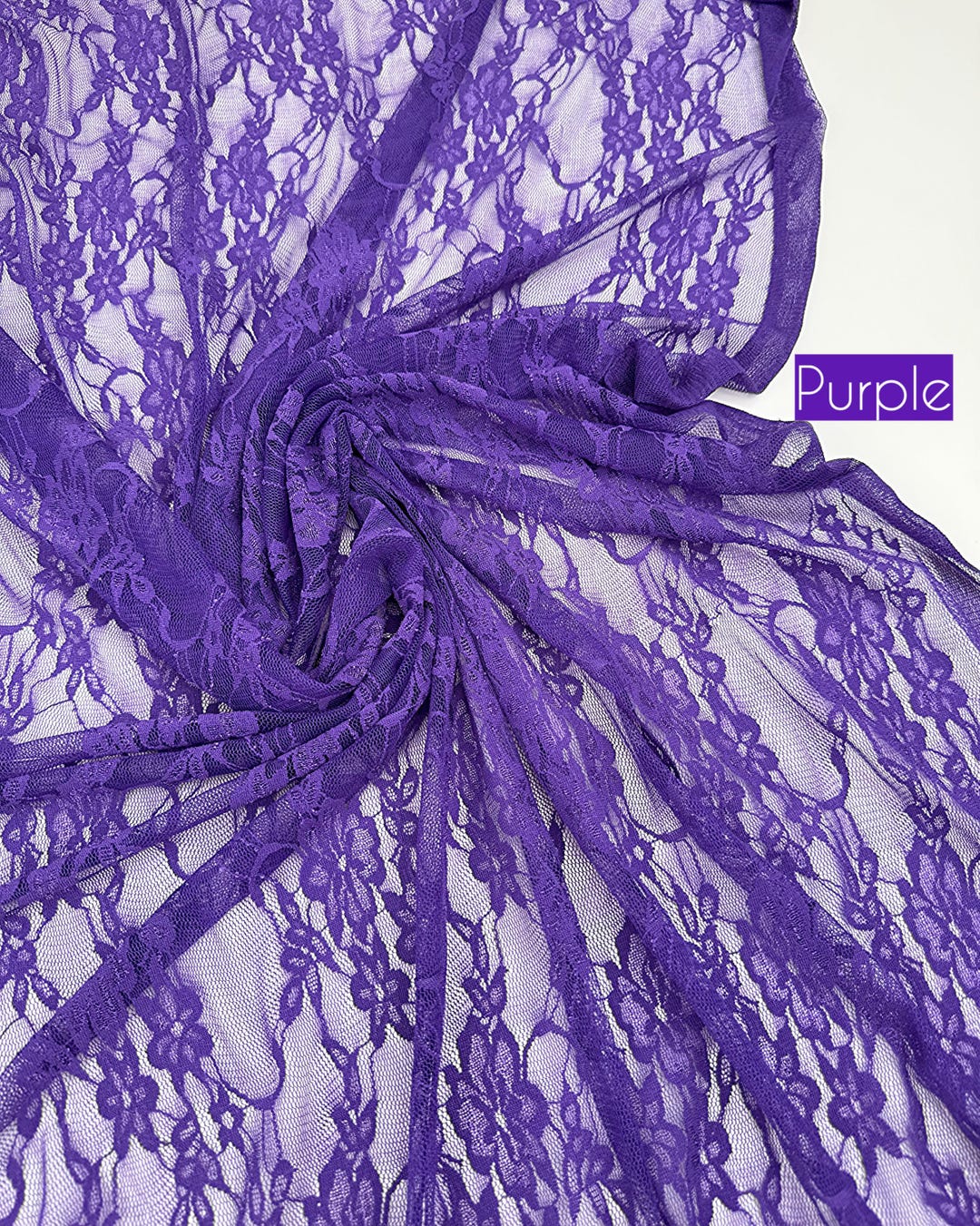 Vibrant purple eggplant floral stretch lace gathered in soft folds with purple label