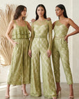 Women wearing green lace jumpsuits showing versatility of moss green stretch lace fabric