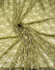 Moss green floral stretch lace fabric draped flat showing texture and open weave