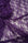 Deep eggplant purple floral stretch lace fabric close-up showing delicate floral pattern