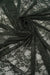 Hunter green floral stretch lace fabric draped and folded showing deep forest green color