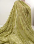 Moss green floral stretch lace fabric draped on mannequin, 4-way stretch vintage style