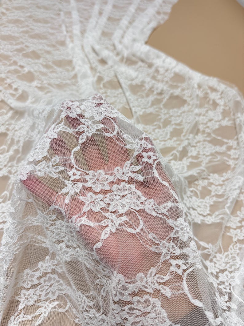 Close up Ivory Floral Stretch Lace Fabric semi-transparent texture detail