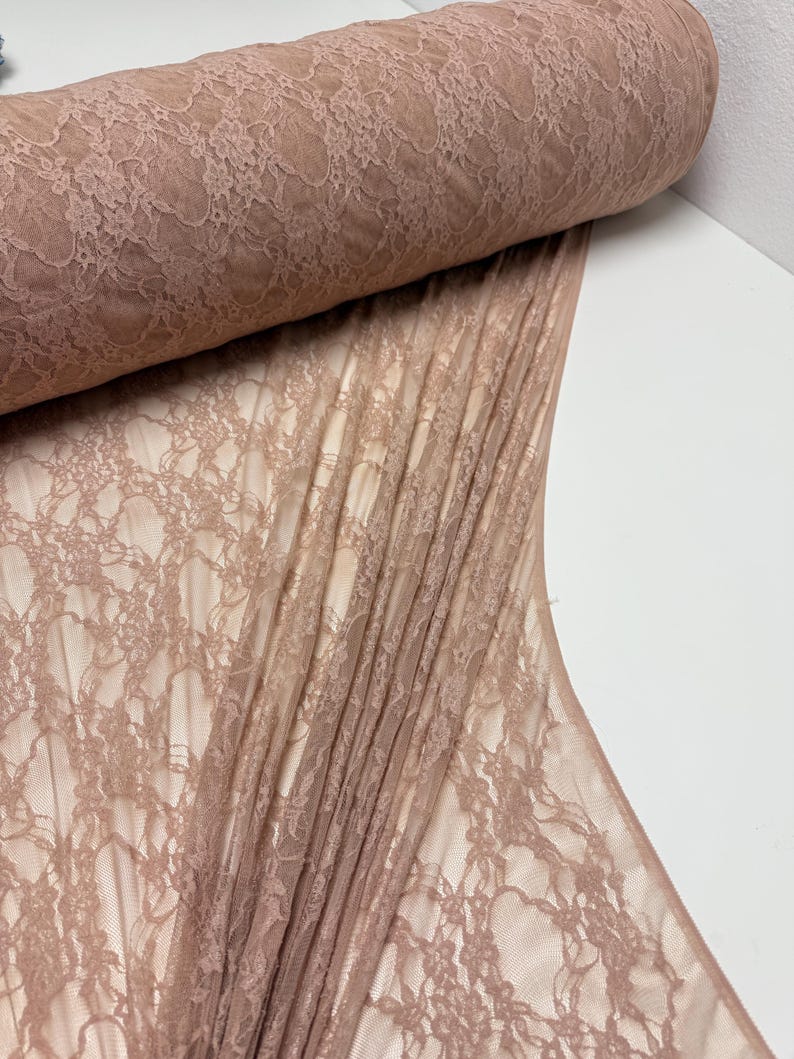 Nude Floral Stretch Lace Fabric partially unrolled revealing intricate floral design