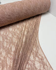 Nude Floral Stretch Lace Fabric partially unrolled revealing intricate floral design