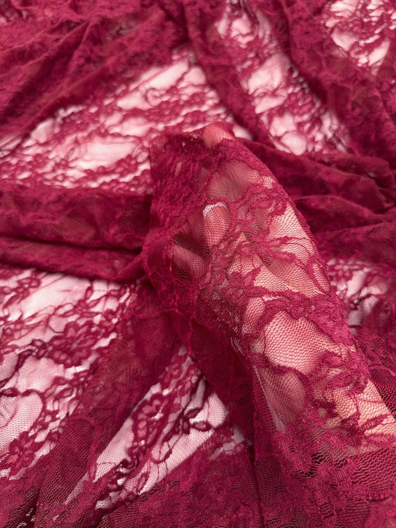 Burgundy Floral Stretch Lace Fabric gathered folds showing sheer texture and depth