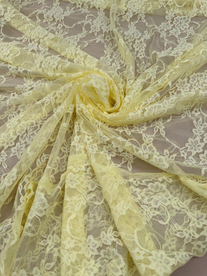 Close up detail of Butter Yellow Floral Stretch Lace Fabric showing rose pattern