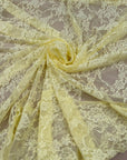 Close up detail of Butter Yellow Floral Stretch Lace Fabric showing rose pattern