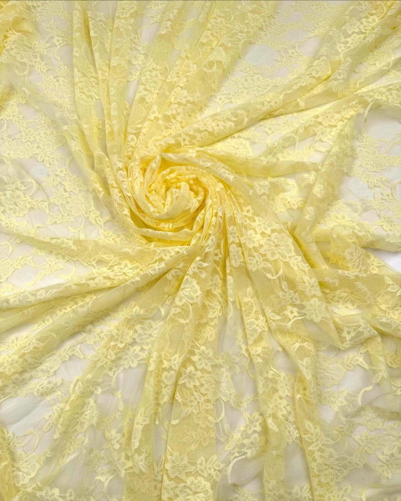 Butter Yellow Floral Stretch Lace in soft folds showing sheer quality