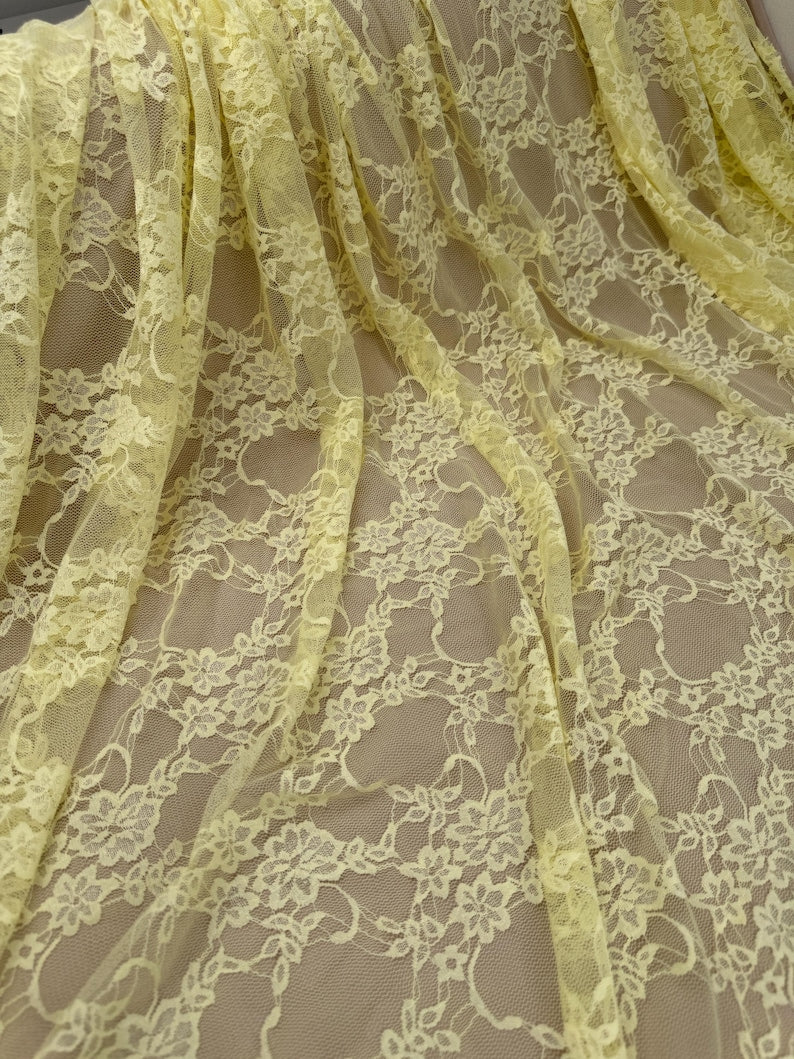Butter Yellow Floral Lace Fabric close up showing floral and leaf pattern detail