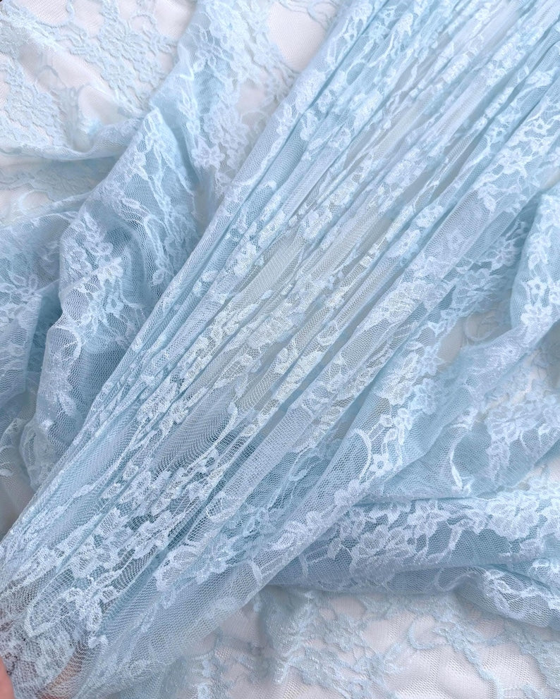 Close up of Baby Blue Floral Stretch Lace showing layered intricate floral pattern