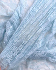 Close up of Baby Blue Floral Stretch Lace showing layered intricate floral pattern