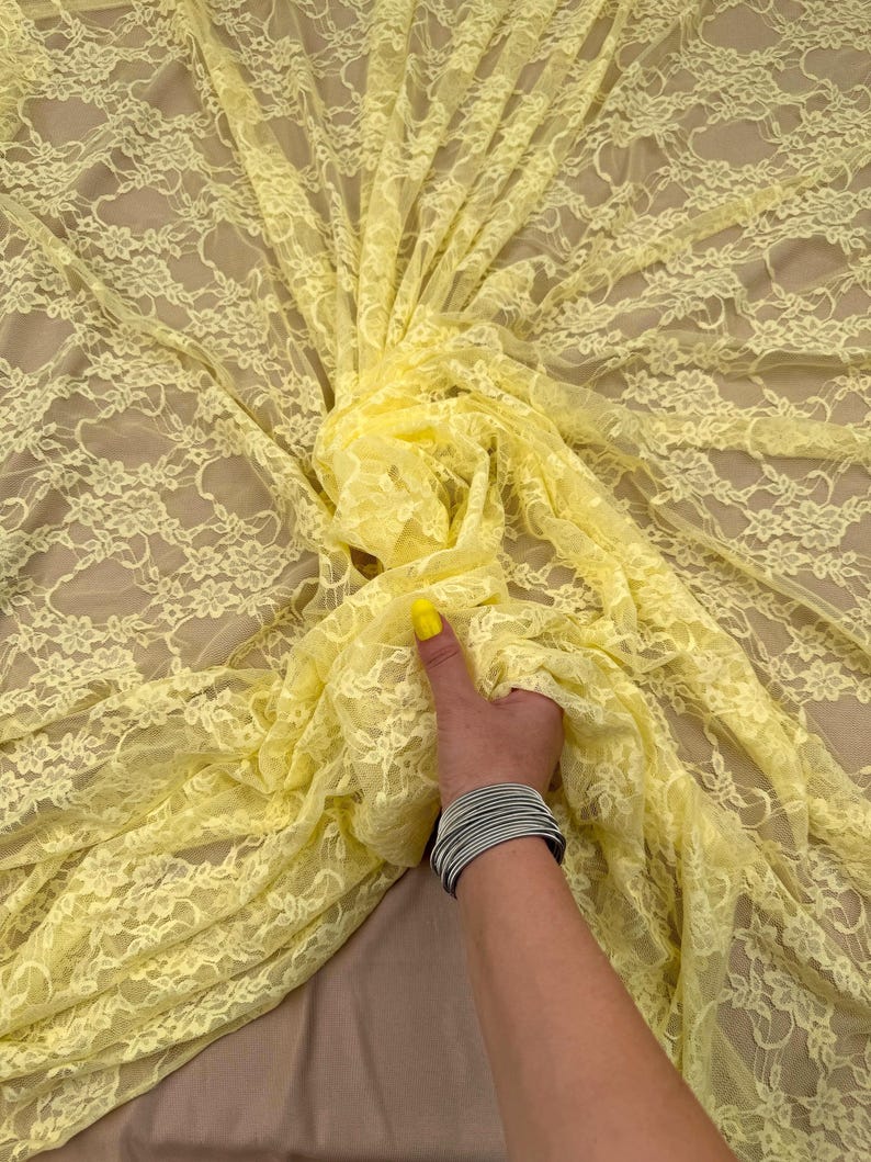 Butter Yellow Stretch Floral Lace Fabric draped in elegant backless gown style