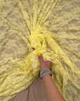Butter Yellow Stretch Floral Lace Fabric draped in elegant backless gown style