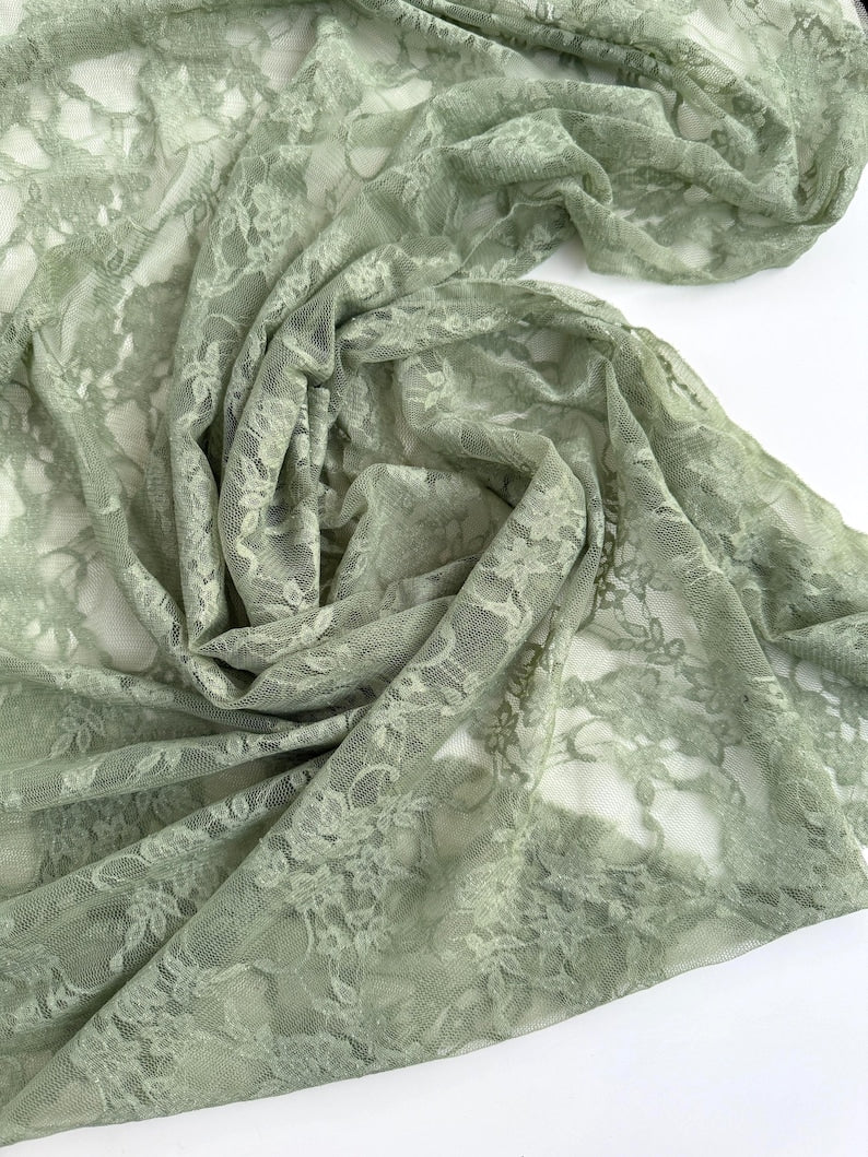 Sage Green Floral Stretch Lace Fabric draped showing semi-sheer matte finish