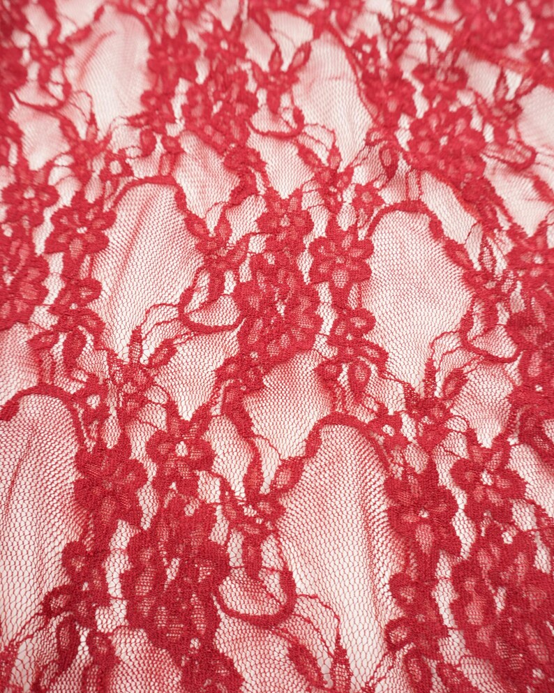 Red Floral Stretch Lace Fabric close up intricate flowers and leaves semi-transparent