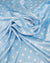 Dusty blue satin fabric with small white polka dots draped in soft folds