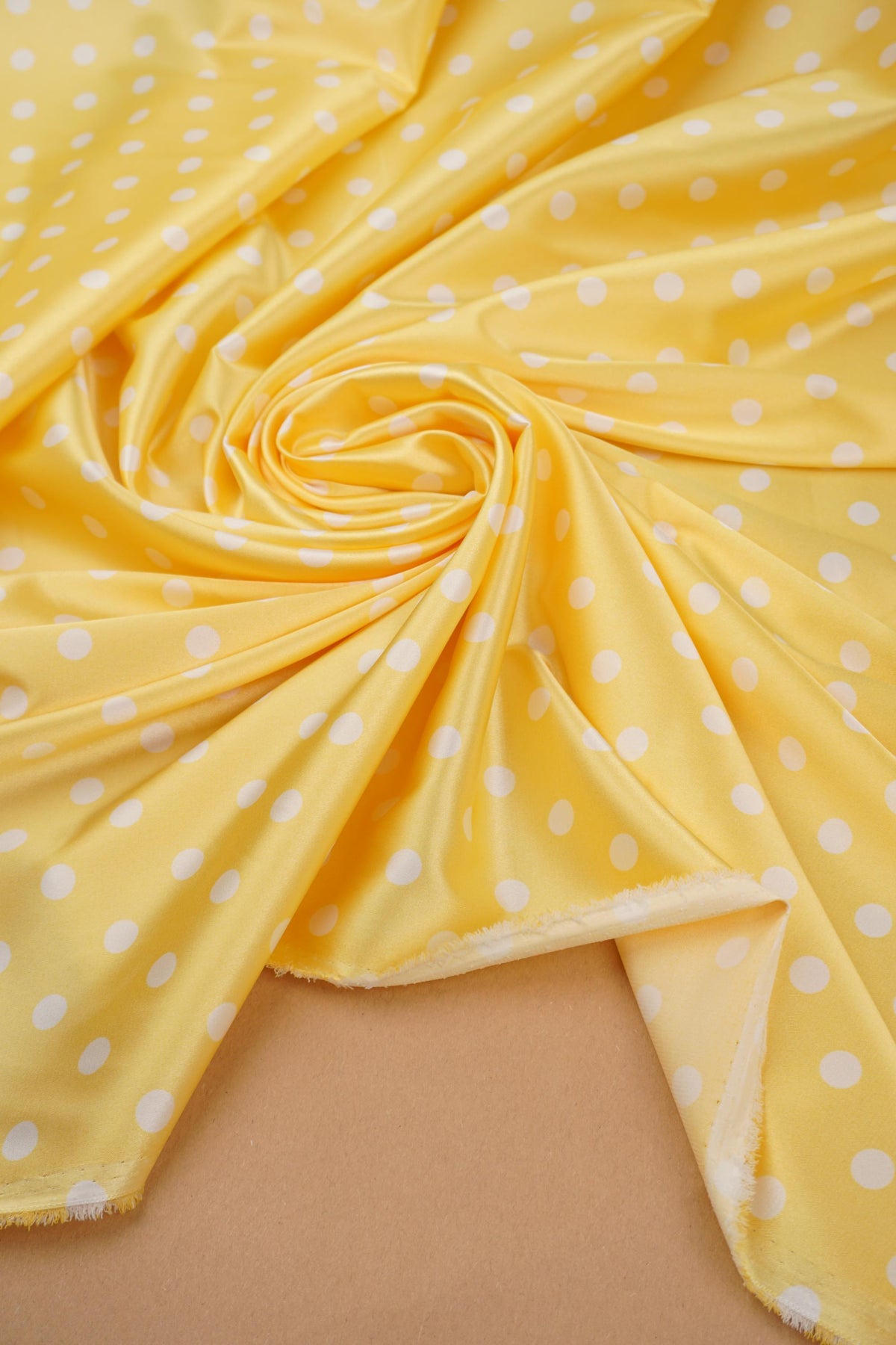 Banana yellow polka dot satin gathered to show drape