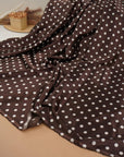Soft lightweight chocolate brown polka dot fabric with fluid drape