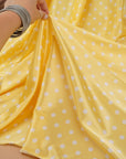 Yellow and white polka dot satin folds